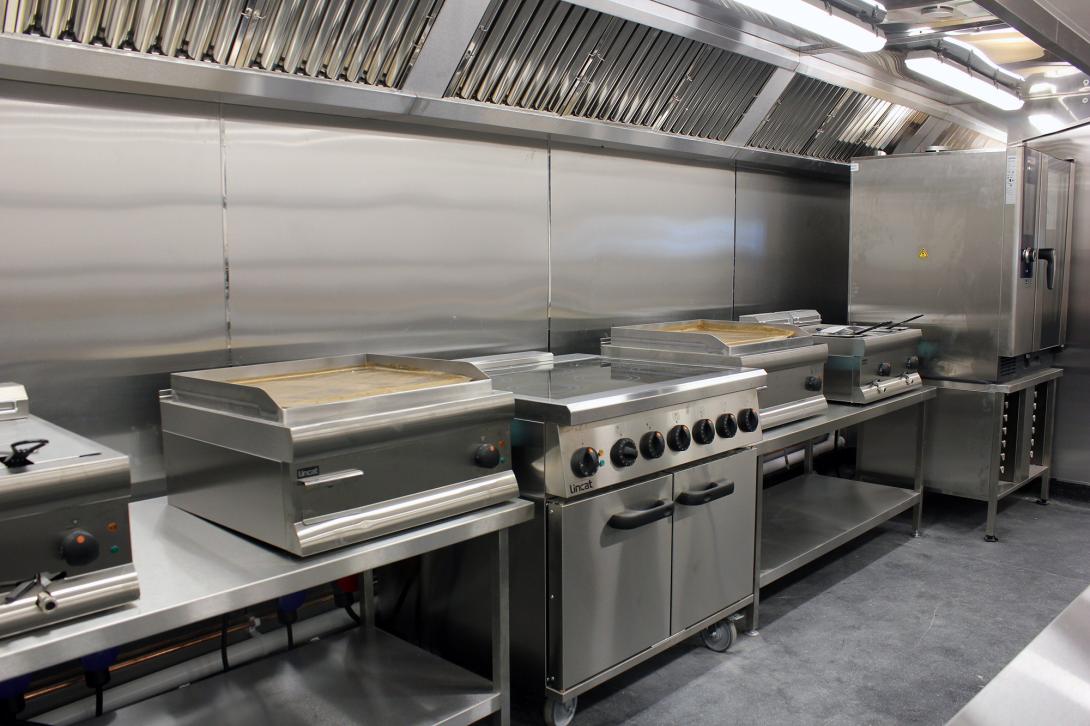 This image shows a fully electric commercial cookline with a Rational on the end. 